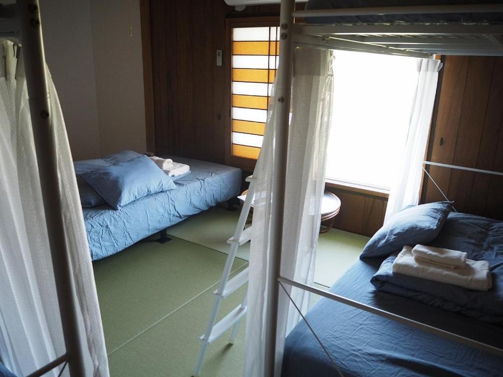 Guesthouse ＆ Beach Cafe Fuego Hyuga Стая снимка